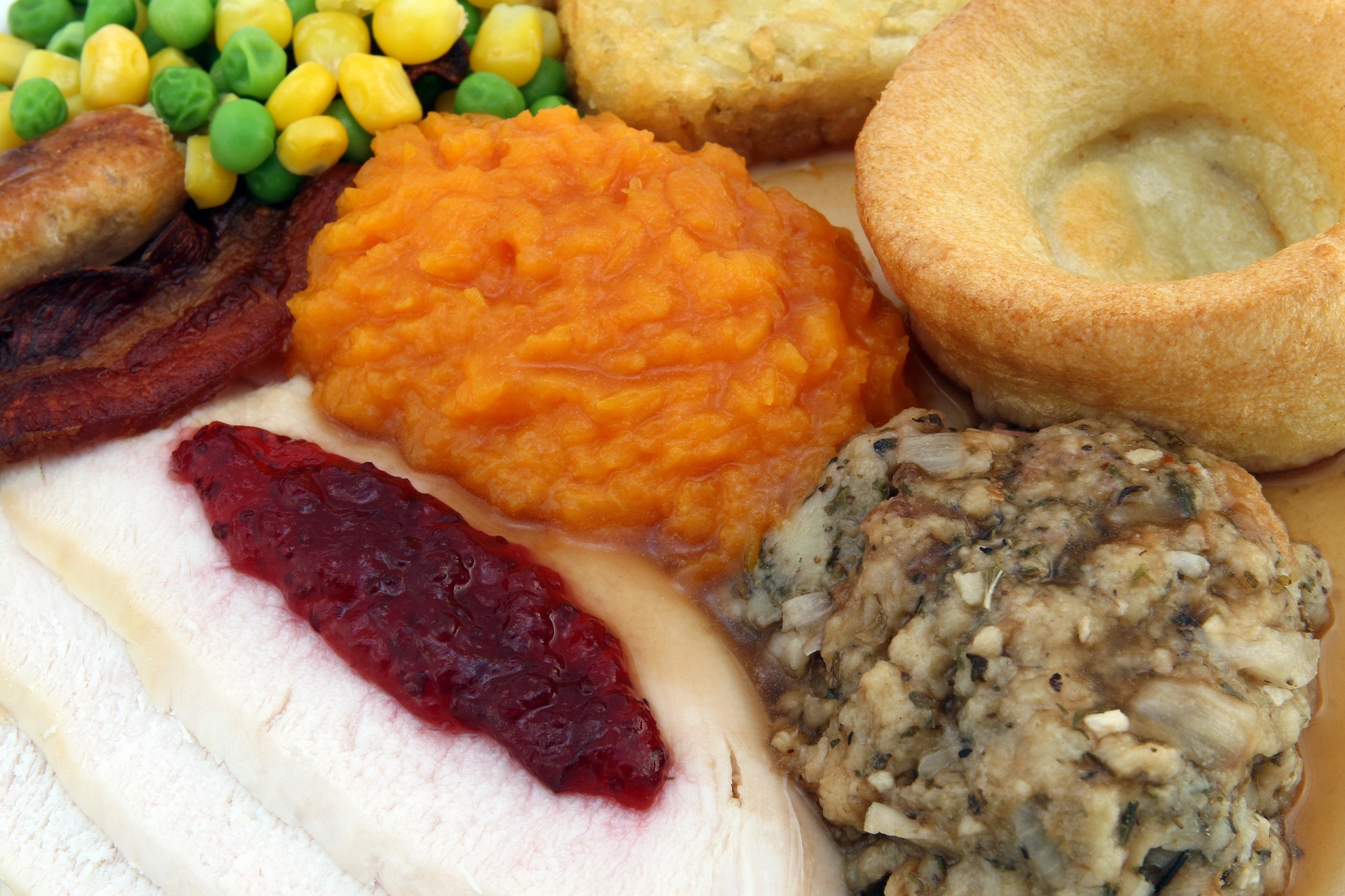 A plate filled with typical Thanksgiving food