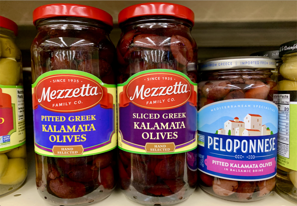 Jars of Greek-style olives in the grocery store