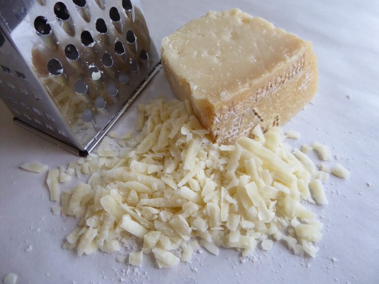 Block of Parmesan with some of it grated