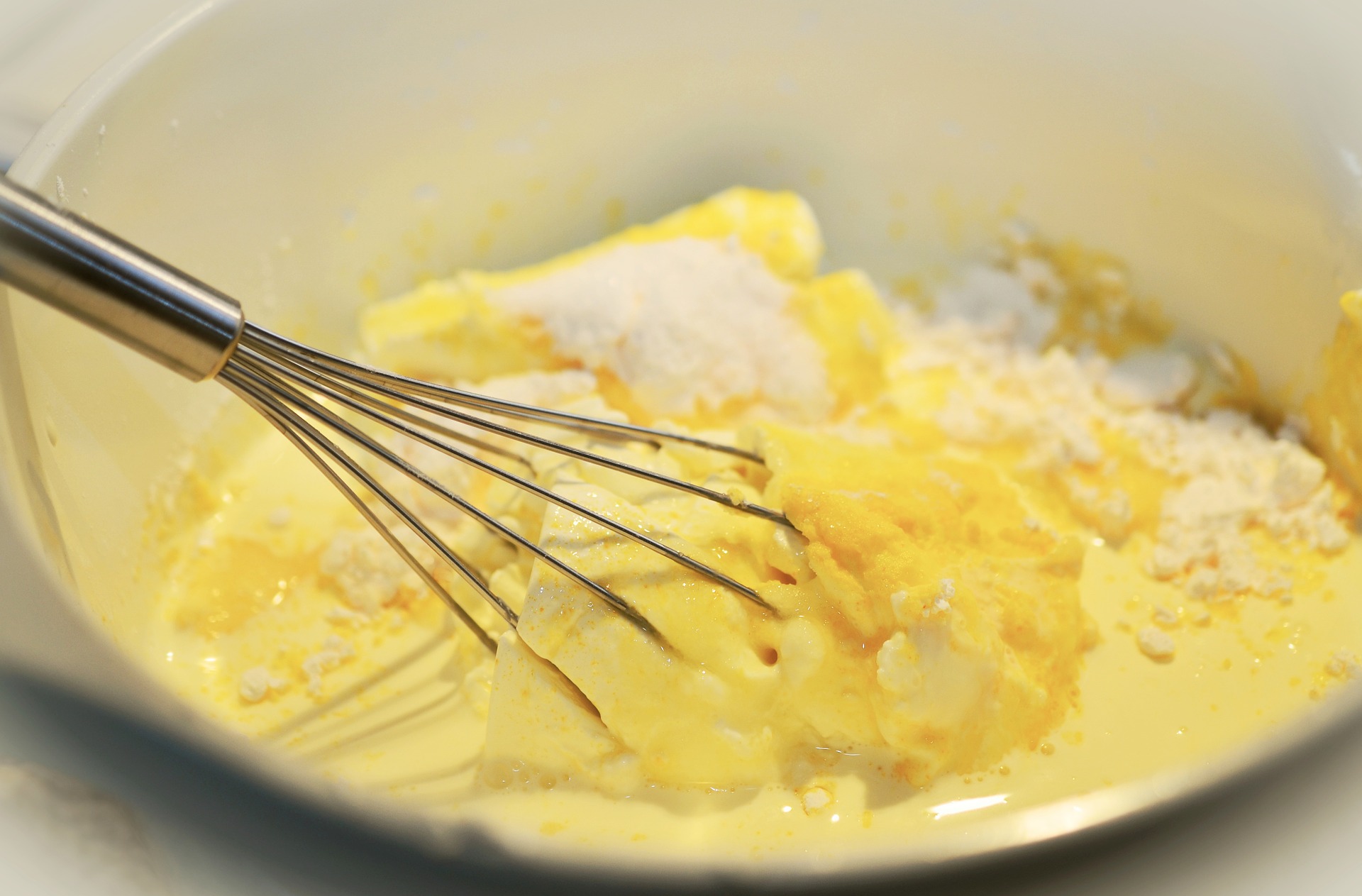 Bowl filled with softened butter and sugar