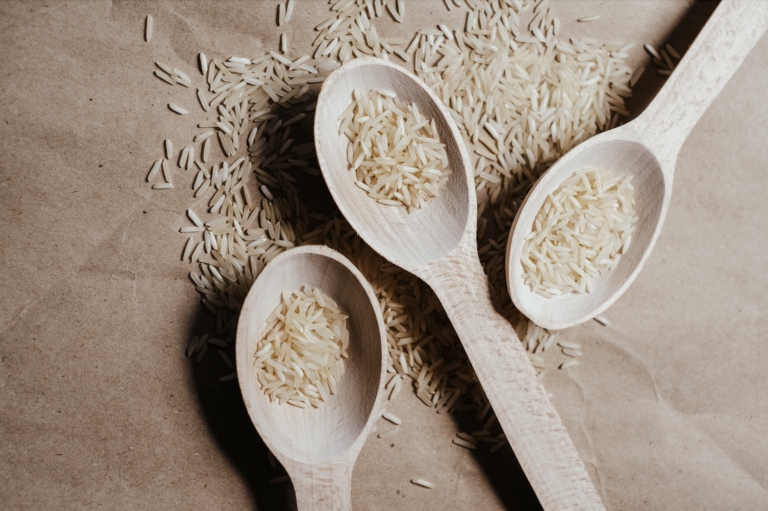 Wooden spoons filled with rice