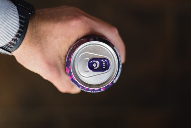 A man holding a can of Bubbly